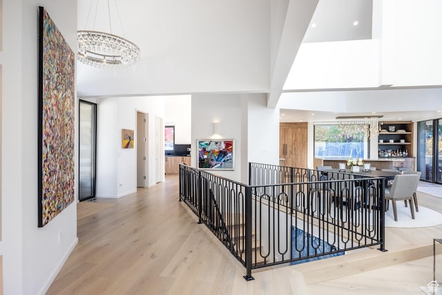2559 Lupine Ln, Park City, UT 84060 - corridor with an upstairs landing, a high ceiling, a chandelier, wood finished floors, and recessed lighting