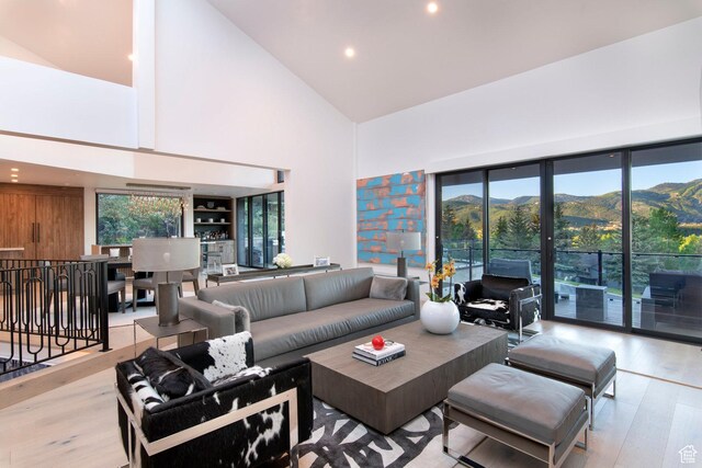 2559 Lupine Ln, Park City, UT 84060 - living area featuring high vaulted ceiling, wood finished floors, a mountain view, and recessed lighting