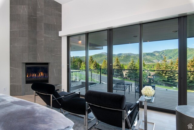 2559 Lupine Ln, Park City, UT 84060 - bedroom featuring multiple windows, a mountain view, access to outside, and a fireplace