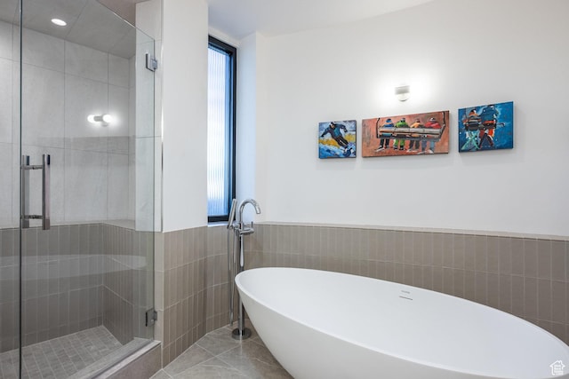 2559 Lupine Ln, Park City, UT 84060 - full bath featuring a soaking tub, a shower stall, tile walls, and a wainscoted wall