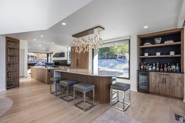2559 Lupine Ln, Park City, UT 84060 - kitchen with wine cooler, a large island, light wood finished floors, modern cabinets, and recessed lighting