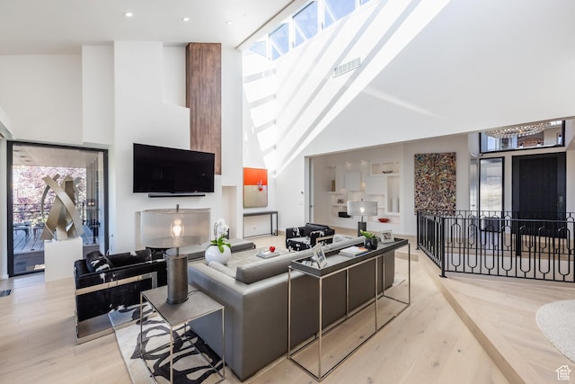 2559 Lupine Ln, Park City, UT 84060 - living area featuring wood finished floors, high vaulted ceiling, a skylight, and recessed lighting