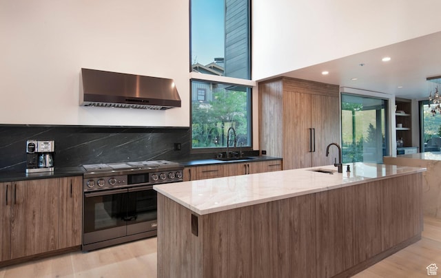 2559 Lupine Ln, Park City, UT 84060 - kitchen with wall chimney range hood, electric stove, modern cabinets, brown cabinets, and recessed lighting