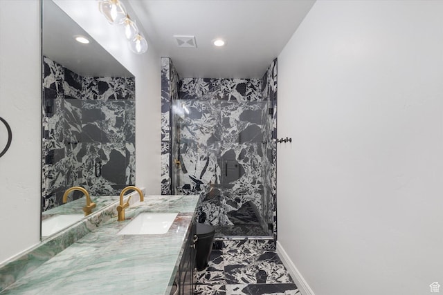 bathroom with visible vents, marble finish floor, an accent wall, and vanity