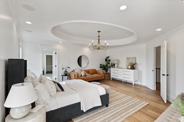 bedroom with light wood-type flooring, ornamental molding, recessed lighting, and a raised ceiling