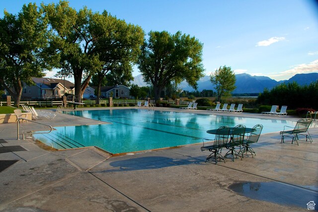 2421 S Blue Water Ln E, Saratoga Springs, UT 84045 - pool with a patio and a mountain view