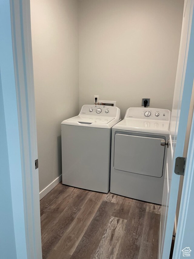 2421 S Blue Water Ln E, Saratoga Springs, UT 84045 - washroom featuring separate washer and dryer, laundry area, baseboards, and wood finished floors