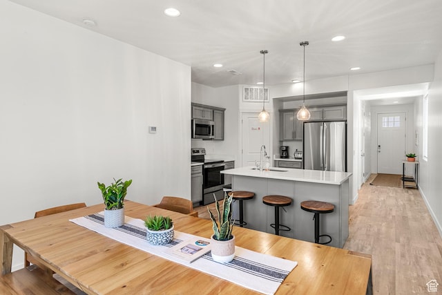 529 Richland Valley St, Garden City, UT 84028 - dining space with light wood-style flooring, recessed lighting, visible vents, and baseboards