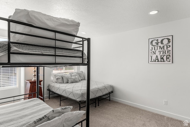 529 Richland Valley St, Garden City, UT 84028 - carpeted bedroom with recessed lighting, baseboards, multiple windows, and a textured ceiling