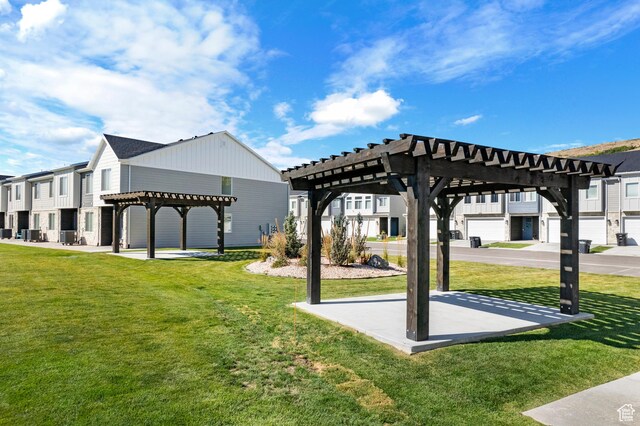 529 Richland Valley St, Garden City, UT 84028 - view of community featuring a residential view, a lawn, and a pergola