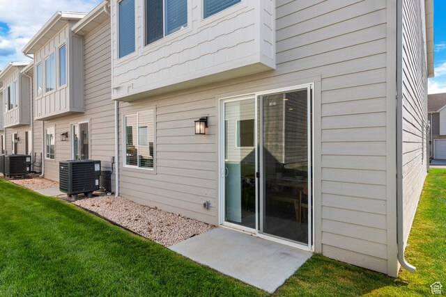 529 Richland Valley St, Garden City, UT 84028 - back of house with central air condition unit and a yard