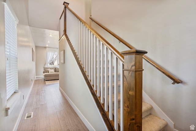 3323 E Gibraltar Ave, Eagle Mountain, UT 84005 - staircase with visible vents, baseboards, and wood finished floors