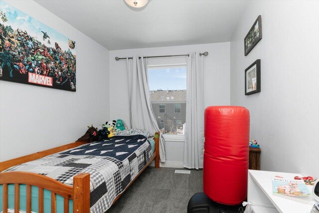 bedroom with baseboards and carpet floors