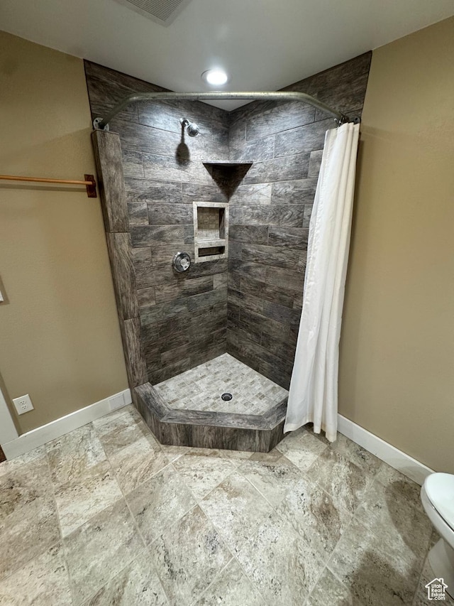 350 S 50 W, Ephraim, UT 84627 - full bathroom featuring toilet, a stall shower, baseboards, and visible vents