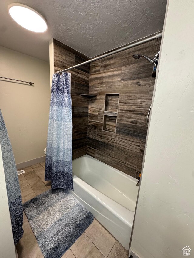 350 S 50 W, Ephraim, UT 84627 - full bathroom featuring toilet, shower / bathtub combination with curtain, baseboards, and tile patterned flooring