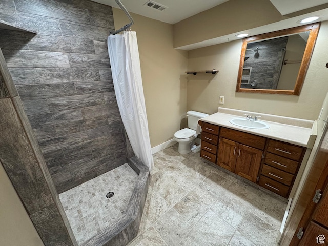 350 S 50 W, Ephraim, UT 84627 - bathroom featuring toilet, tiled shower, vanity, and visible vents