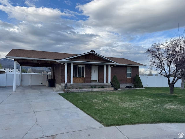 350 S 50 W, Ephraim, UT 84627 - single story home featuring concrete driveway, covered porch, an attached carport, fence, and brick siding