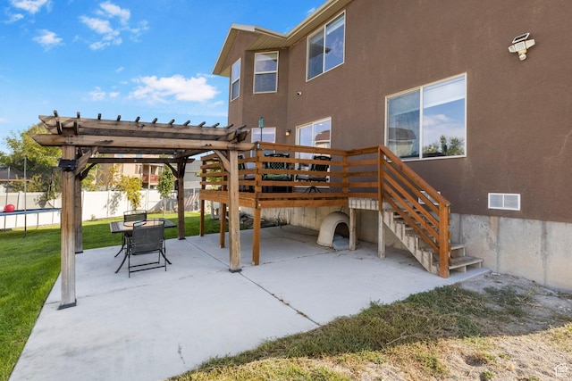 5943 N Bleeker, Stansbury Park, UT 84074 - back of house with a patio, a pergola, stucco siding, and a trampoline