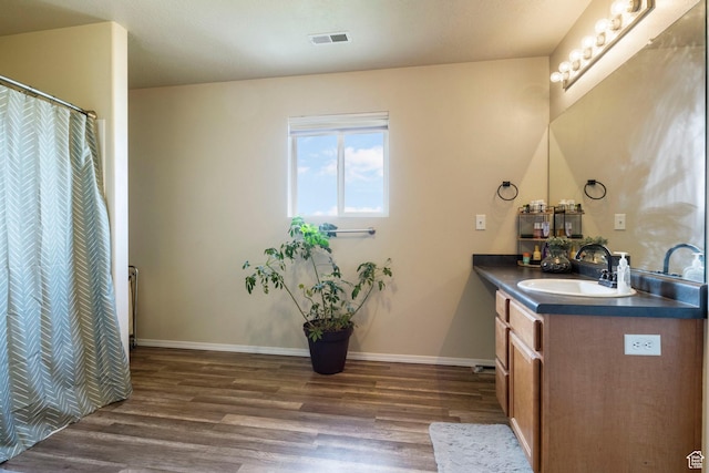 5943 N Bleeker, Stansbury Park, UT 84074 - bathroom featuring wood finished floors and vanity