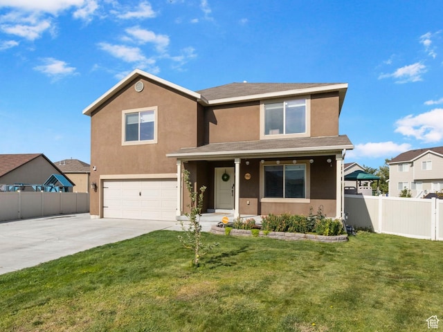 5943 N Bleeker, Stansbury Park, UT 84074 - traditional home with a garage, stucco siding, driveway, and covered porch