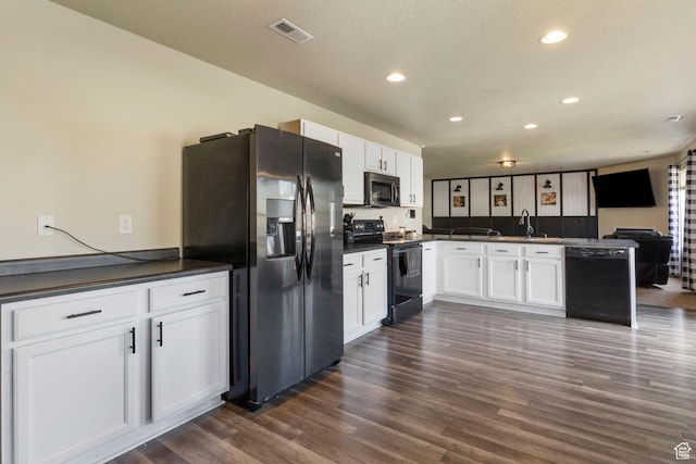 5943 N Bleeker, Stansbury Park, UT 84074 - kitchen with black appliances, dark countertops, a peninsula, white cabinets, and recessed lighting