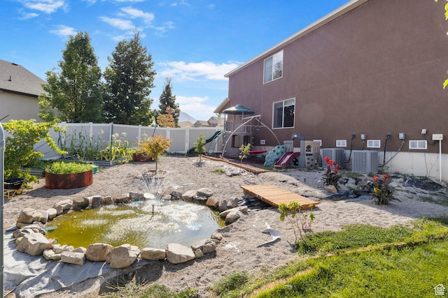 5943 N Bleeker, Stansbury Park, UT 84074 - fenced backyard with a garden pond