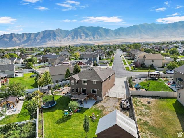 5943 N Bleeker, Stansbury Park, UT 84074 - aerial perspective of suburban area with a mountain backdrop