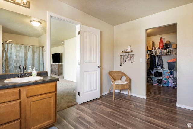 5943 N Bleeker, Stansbury Park, UT 84074 - bathroom featuring wood finished floors and vanity