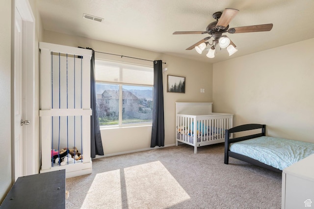 5943 N Bleeker, Stansbury Park, UT 84074 - carpeted bedroom with a ceiling fan and baseboards