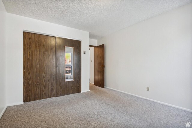 1900 Homestake Rd Unit 32, Park City, UT 84060 - unfurnished bedroom with carpet, a closet, a textured ceiling, and baseboards