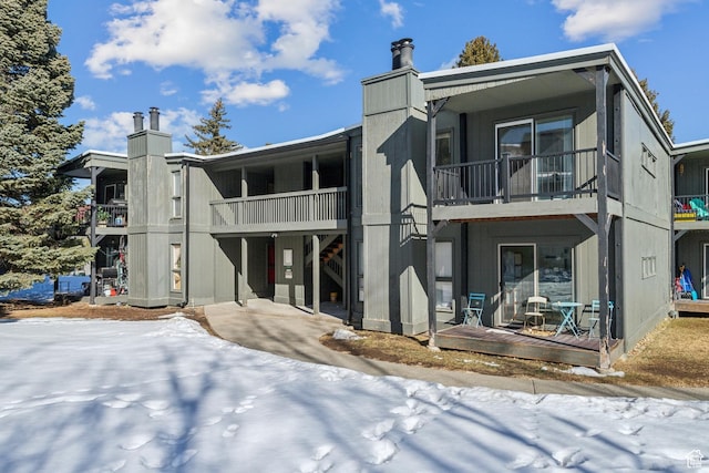 1900 Homestake Rd Unit 32, Park City, UT 84060 - snow covered house featuring a balcony and a chimney