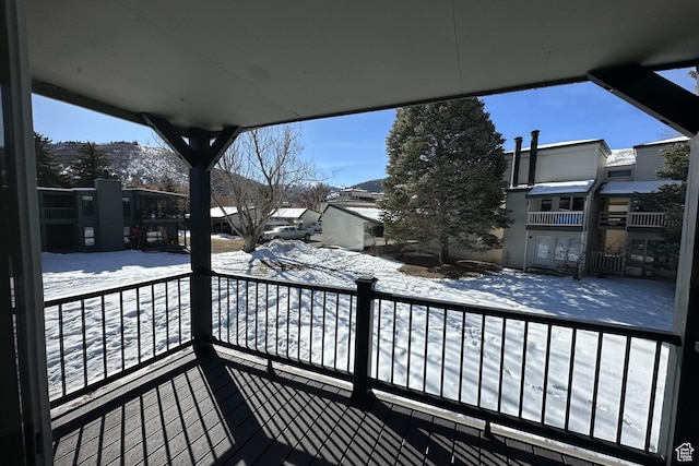 view of snow covered deck