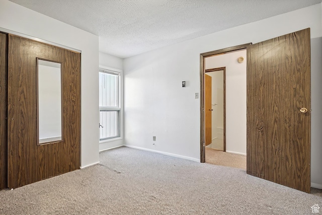 1900 Homestake Rd Unit 32, Park City, UT 84060 - empty room with carpet flooring, a textured ceiling, and baseboards