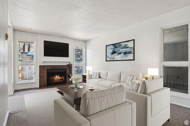 1900 Homestake Rd Unit 32, Park City, UT 84060 - living area with a tile fireplace, carpet, and a textured ceiling
