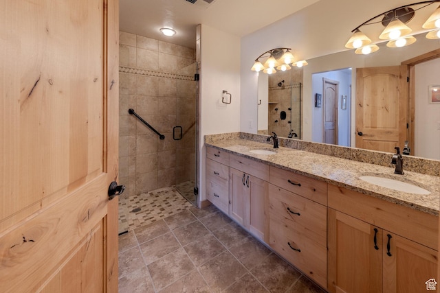 827 N Palisade Dr, Moab, UT 84532 - full bath featuring a sink, visible vents, double vanity, and a shower stall