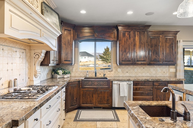 1865 S 3350 E, Heber City, UT 84032 - kitchen featuring stainless steel gas stovetop, custom range hood, dark brown cabinets, backsplash, and recessed lighting