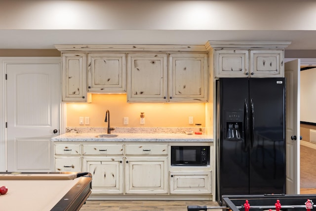 1865 S 3350 E, Heber City, UT 84032 - kitchen featuring black appliances, cream cabinets, and light stone countertops
