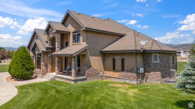 1865 S 3350 E, Heber City, UT 84032 - back of property featuring stone siding, stucco siding, a yard, and roof with shingles