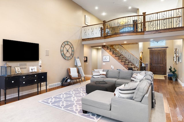1865 S 3350 E, Heber City, UT 84032 - living room with stairs, hardwood / wood-style floors, a high ceiling, and recessed lighting