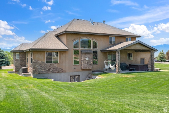 1865 S 3350 E, Heber City, UT 84032 - rear view of house featuring a hot tub, a yard, and stucco siding