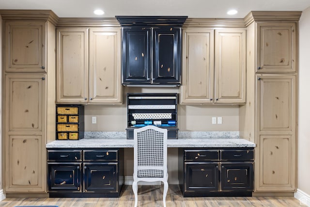 1865 S 3350 E, Heber City, UT 84032 - kitchen featuring built in study area, dark cabinets, light wood-style floors, light stone countertops, and recessed lighting