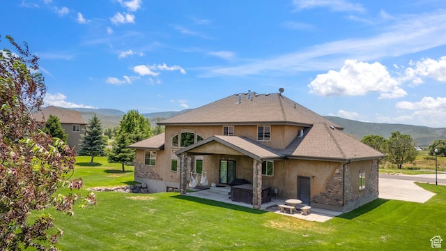 1865 S 3350 E, Heber City, UT 84032 - back of property featuring stucco siding, a mountain view, a patio, and a covered hot tub