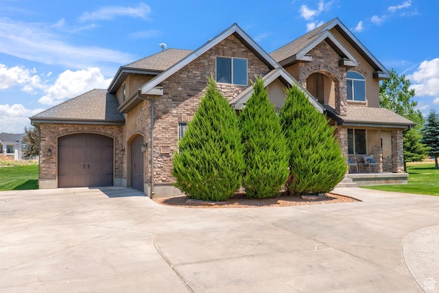 1865 S 3350 E, Heber City, UT 84032 - craftsman-style home with stone siding, driveway, a garage, and roof with shingles