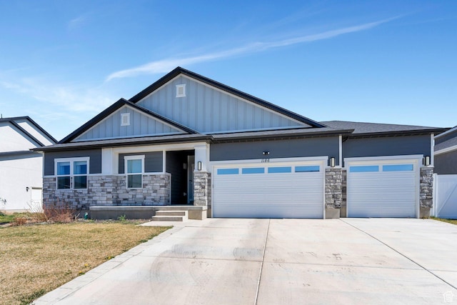1186 N Buckboard Ln, Spanish Fork, UT 84660 - craftsman-style home featuring a garage, driveway, stone siding, and board and batten siding