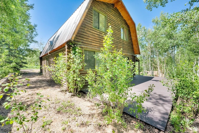 2821 S Deer Run Rd Unit 1011C, Heber City, UT 84032 - view of side of property featuring log siding, a gambrel roof, and metal roof