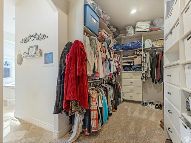 14738 S Currant Creek Cir W, Bluffdale, UT 84065 - walk in closet with arched walkways and tile patterned flooring