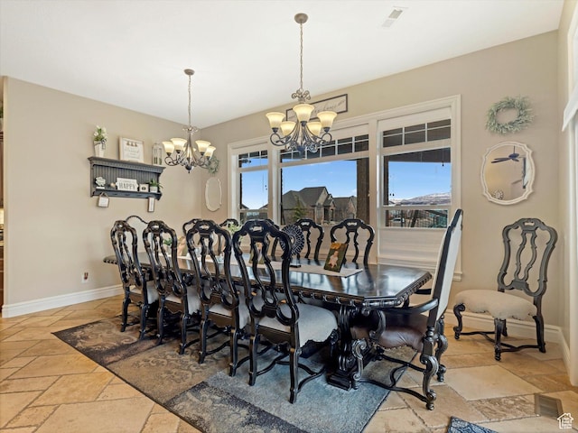 14738 S Currant Creek Cir W, Bluffdale, UT 84065 - dining area with a chandelier, stone tile floors, plenty of natural light, and baseboards