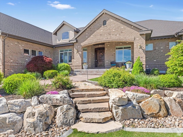 14738 S Currant Creek Cir W, Bluffdale, UT 84065 - view of front of property featuring brick siding and covered porch