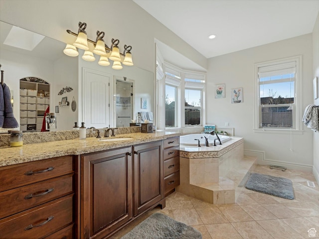 14738 S Currant Creek Cir W, Bluffdale, UT 84065 - bathroom with plenty of natural light, a garden tub, vanity, and tile patterned flooring