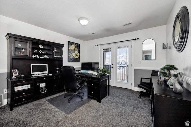 home office with dark colored carpet, french doors, baseboards, and visible vents